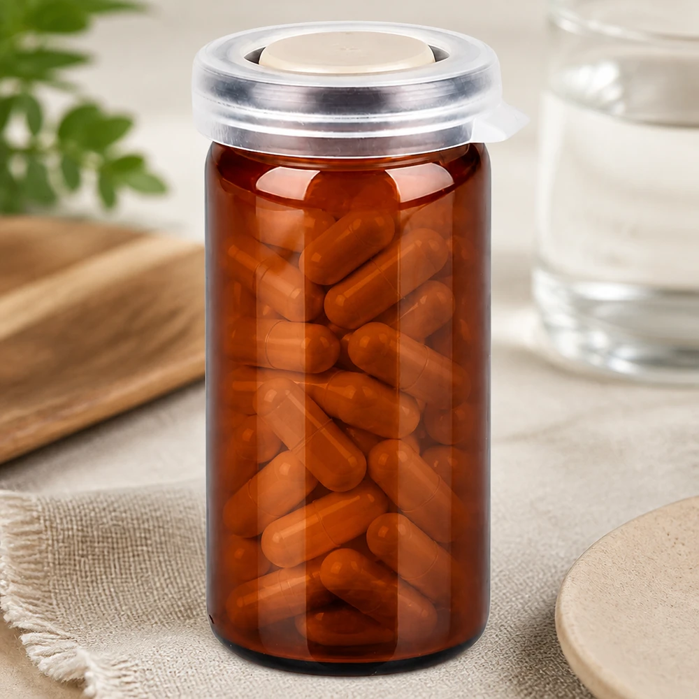 Tabletten/Rollrandglas 10ml braun mit Schnappdeckel Braunes Rollrandglas 10ml mit Schnappdeckel gefüllt mit Kapseln professionelle Pharmaverpackung